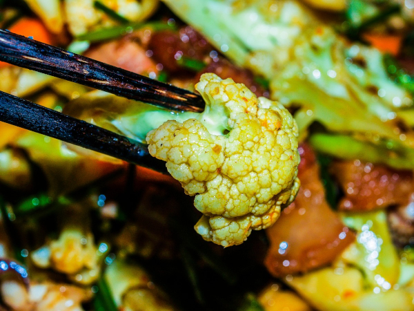 spicy vegetables with chopsticks